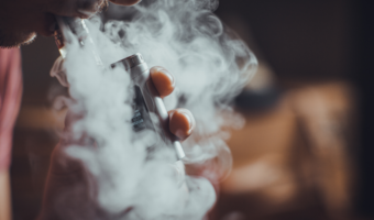 Person smoking a vape.