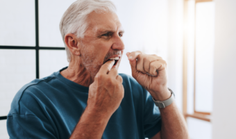Person flossing their teeth.