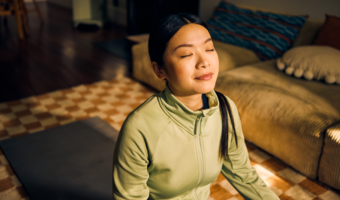 Women sitting in the sun and doing yoga.