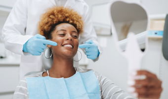 Patient getting their teeth cleaned at the dentist.