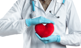 Doctor holding a pillow heart.