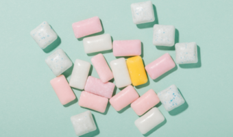 Gum and mints sitting on a table.