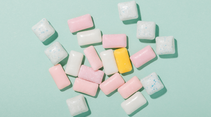Gum and mints sitting on a table.
