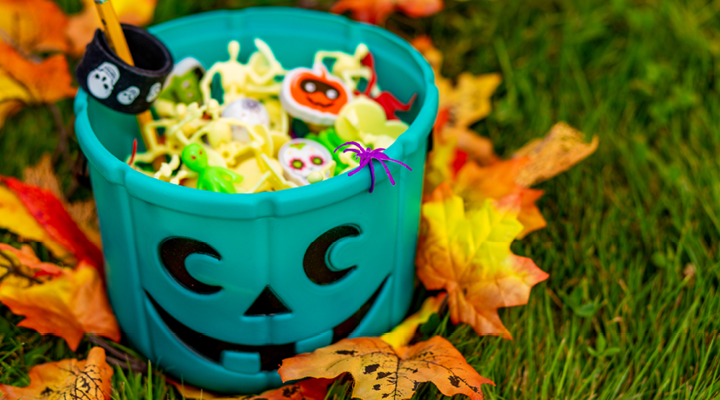 Bowl of halloween candy and toys.