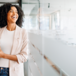 Person smiling and laughing at work.