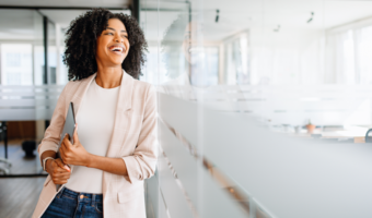 Person smiling and laughing at work.