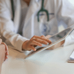 Dentist going through insurance plan with a patient.