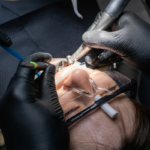 Person getting their tooth reshaped by a dentist.